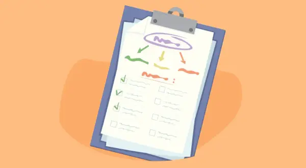Lista de nuevas metas para el año nuevo en un portapapeles, con casillas de verificación y un diagrama de flujo.